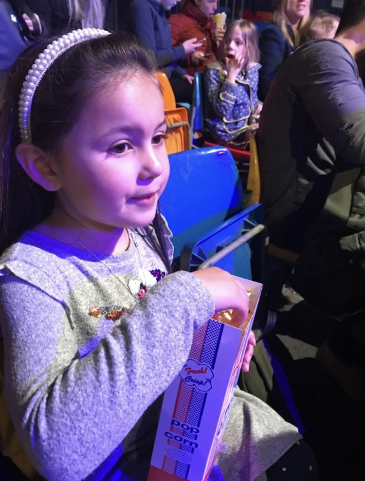 girl eating popcorn