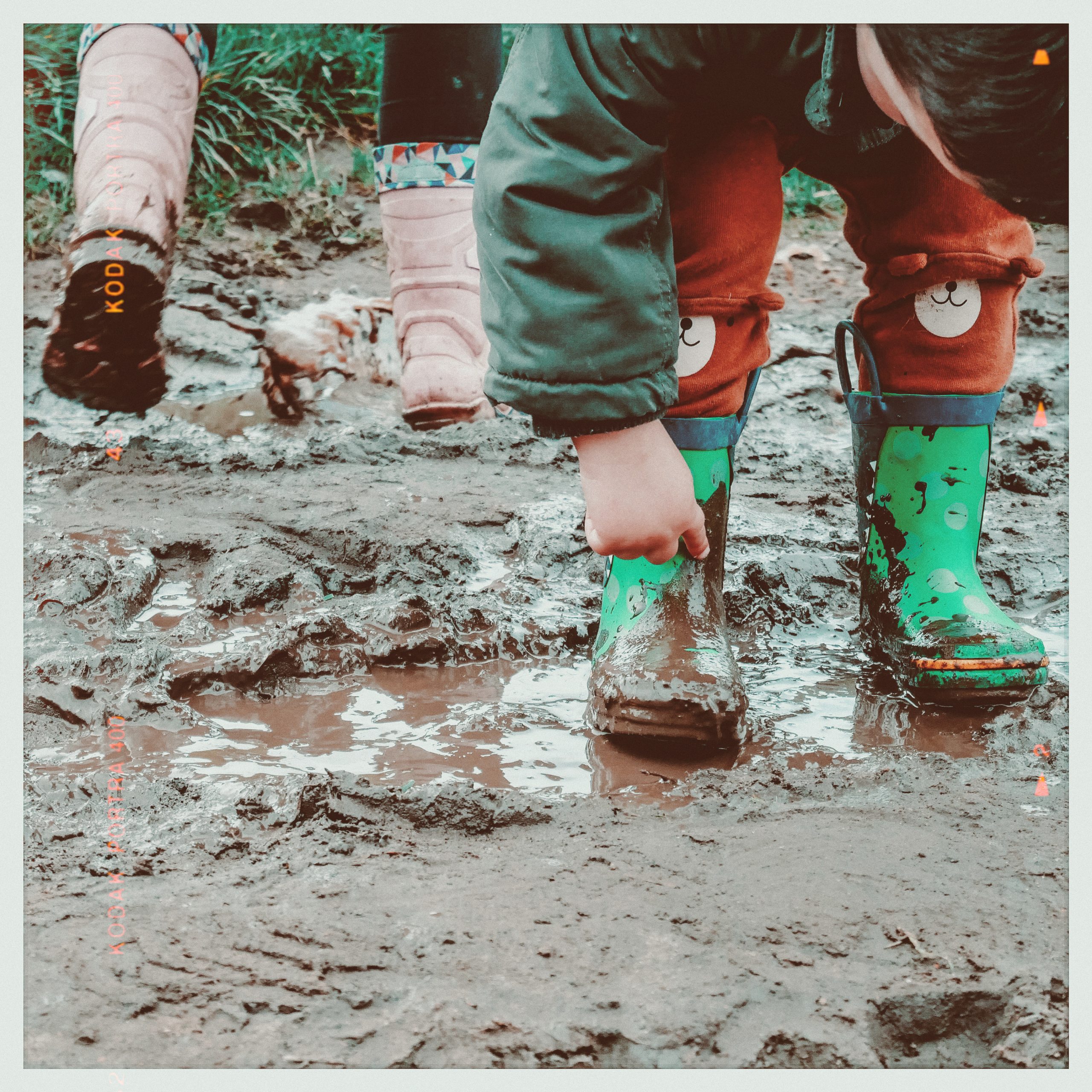 jumping in muddy puddles