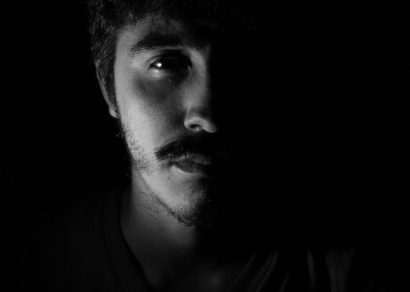 monochrome photo of man showing sadness