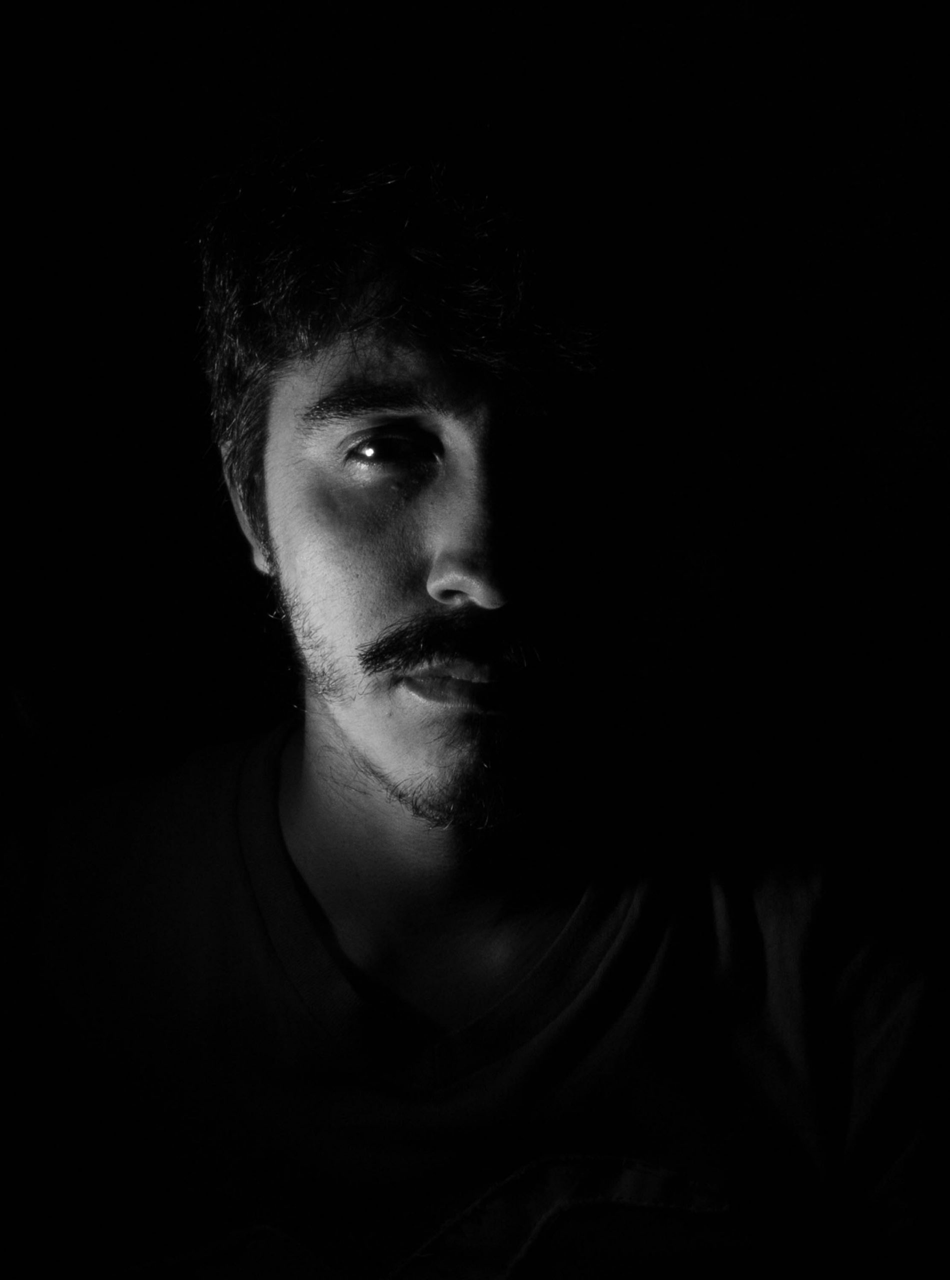 monochrome photo of man showing sadness