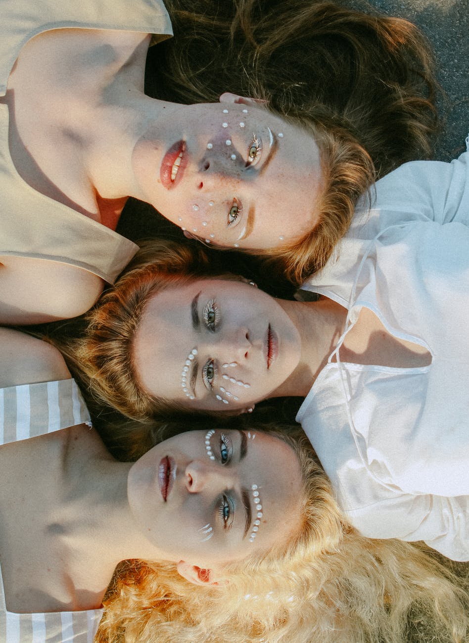 top view photo of women with face art